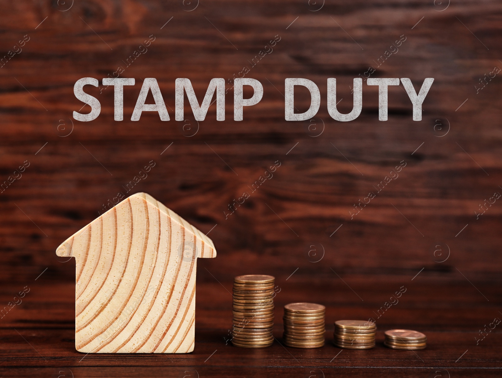 Image of Stamp duty. House model and coins on wooden background