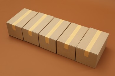 Group of cardboard boxes on brown background