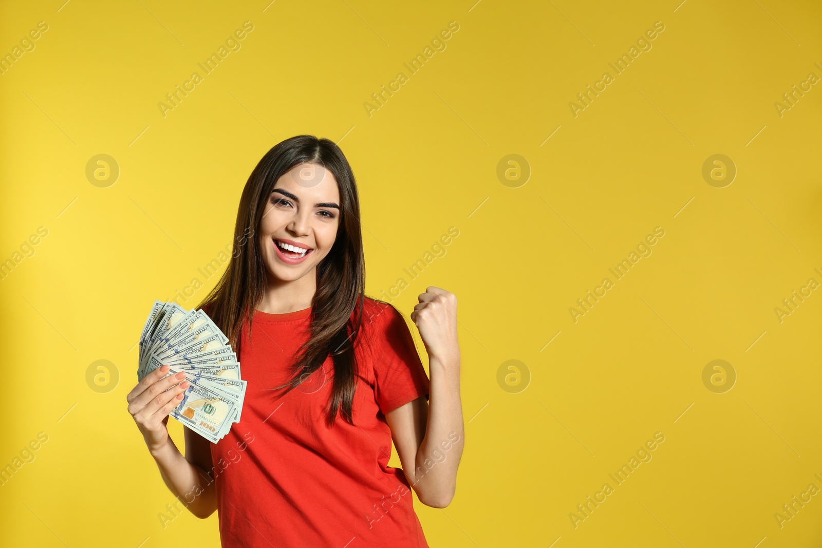 Photo of Young woman with money on color background. Space for text