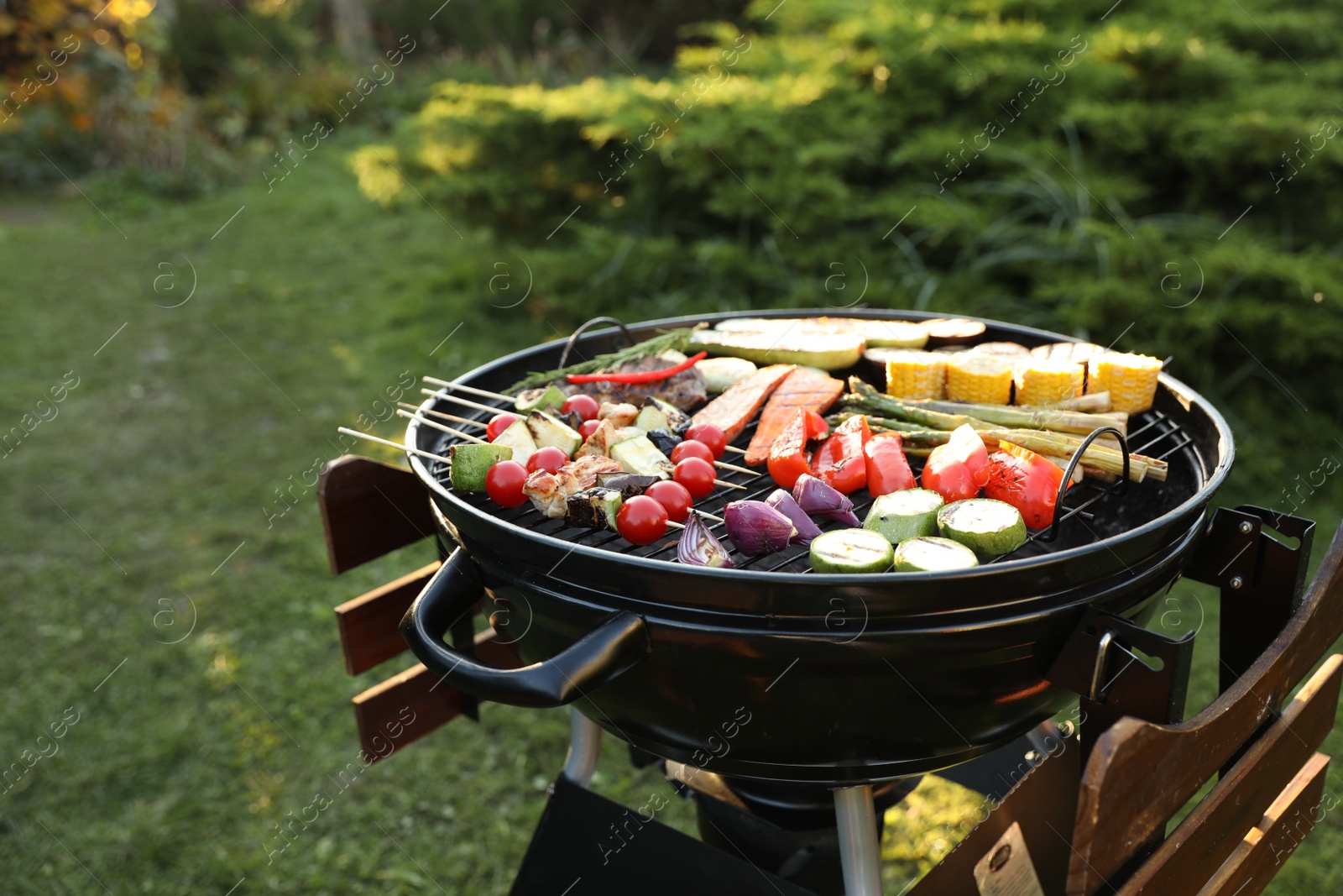 Photo of Delicious grilled vegetables on barbecue grill outdoors