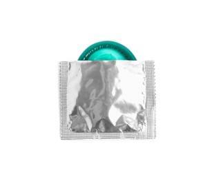 Photo of Torn condom package isolated on white, top view. Safe sex