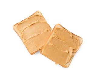 Photo of Tasty peanut butter sandwiches on white background, top view