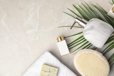 Flat lay composition with soap dispenser on marble background. Space for text