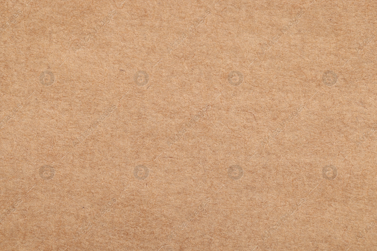 Photo of Texture of beige paper sheet as background, top view