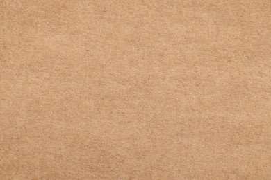 Photo of Texture of beige paper sheet as background, top view