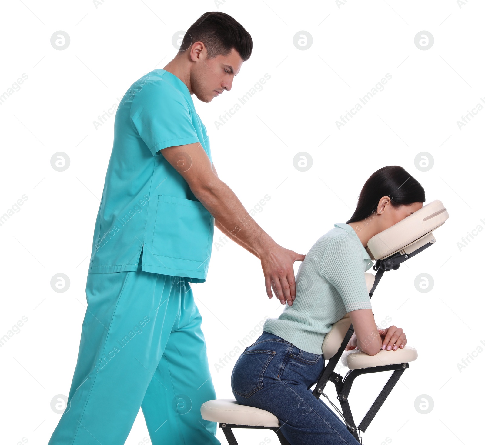 Photo of Woman receiving massage in modern chair on white background