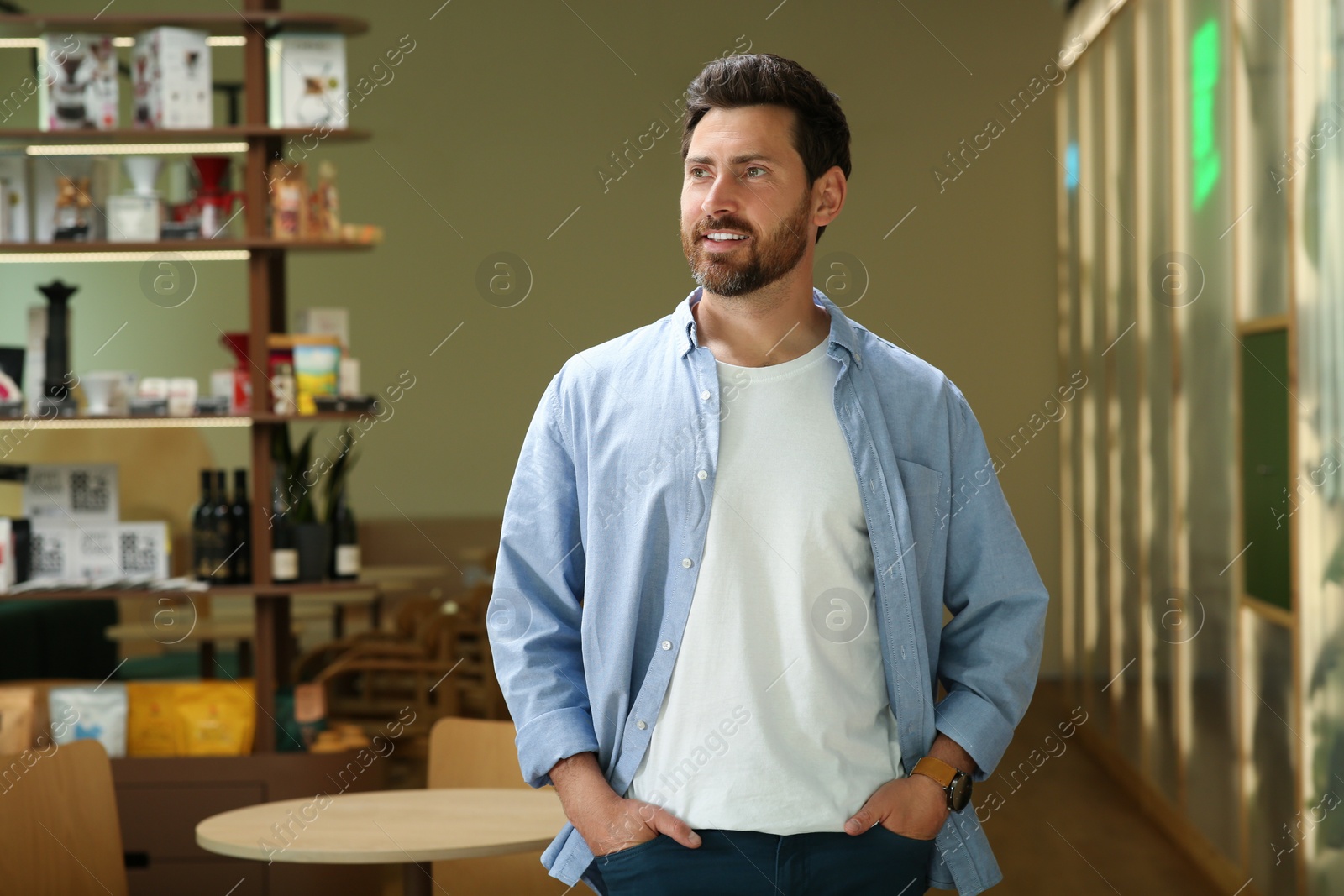 Photo of Portrait of handsome stylish man in cafe