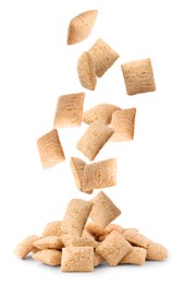 Image of Sweet crispy corn pads falling into pile on white background 