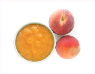 Peach puree in bowl and fresh fruits on white background, top view