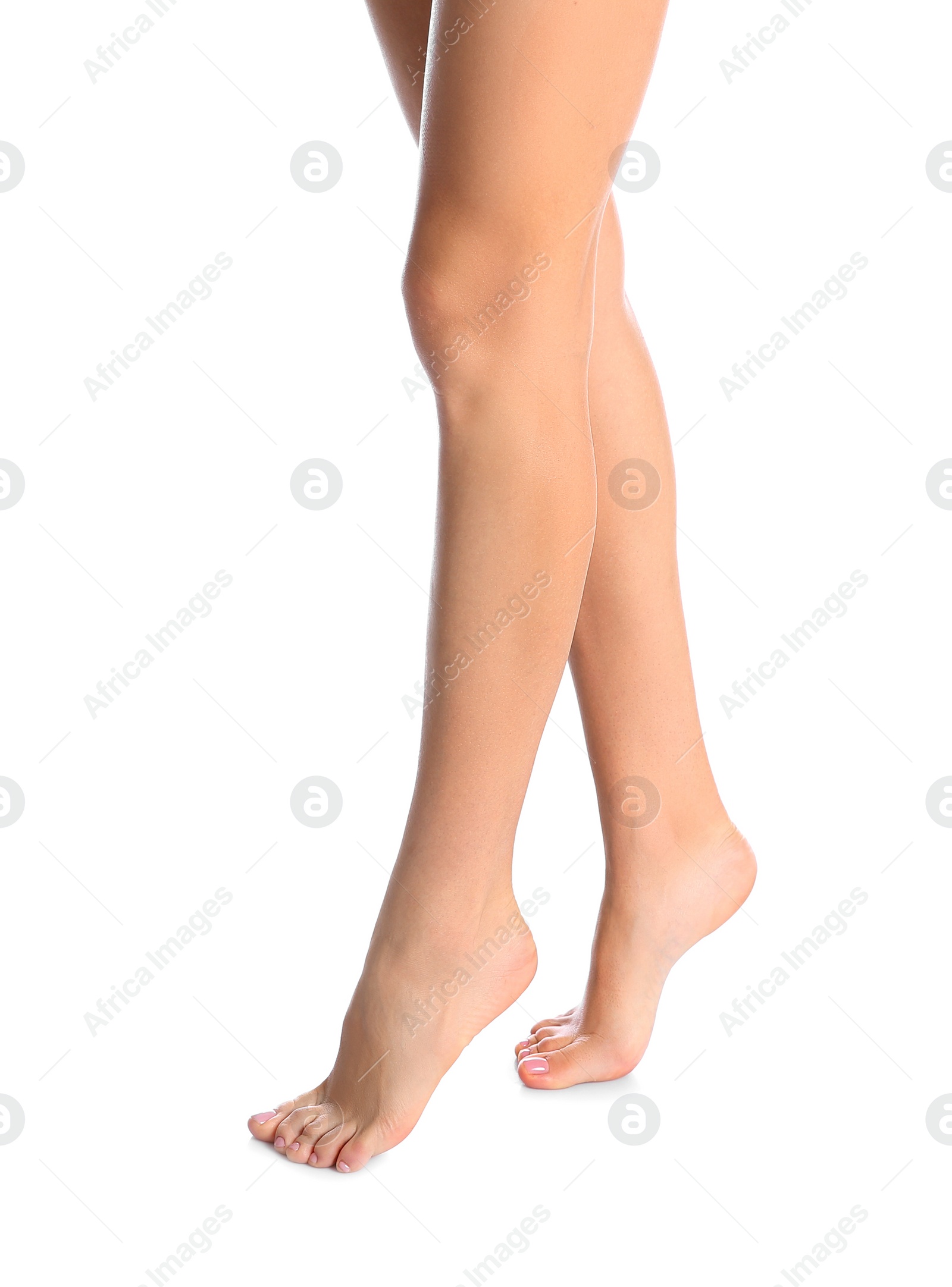 Photo of Woman with beautiful legs and feet on white background, closeup. Spa treatment