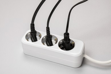 Power strip with electrical plugs on white background