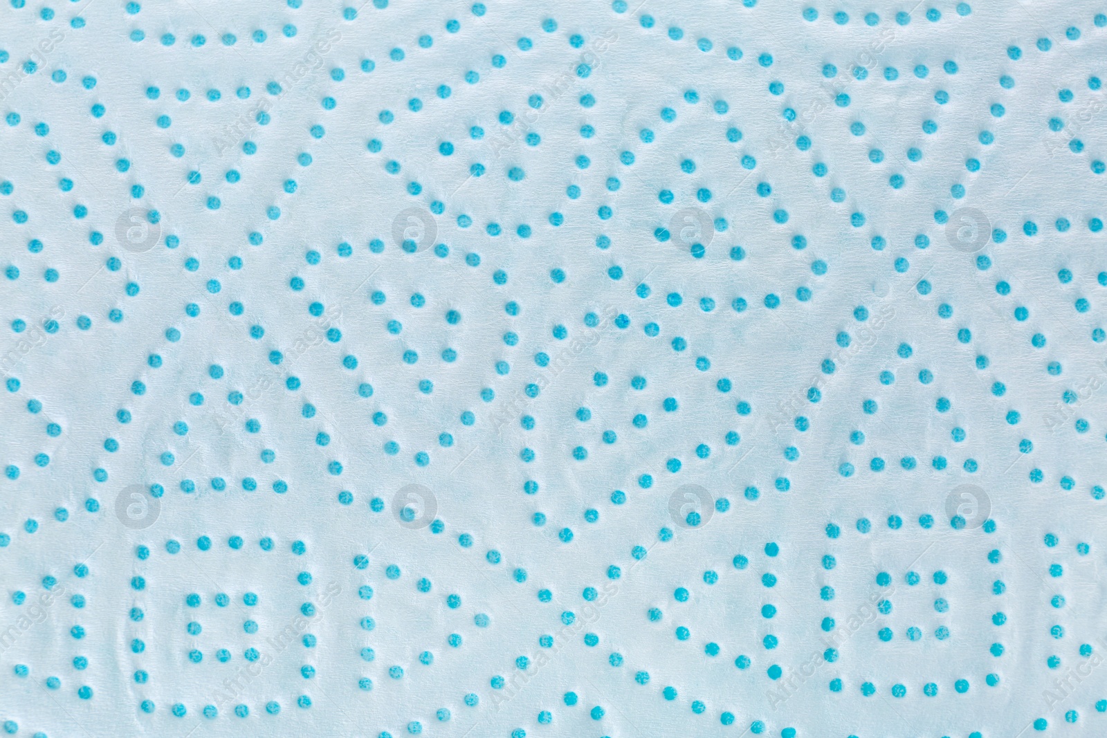 Photo of Perforated toilet paper as background, closeup. Personal hygiene