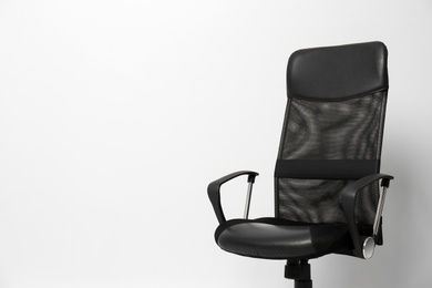 Photo of Comfortable office chair on white background, space for text