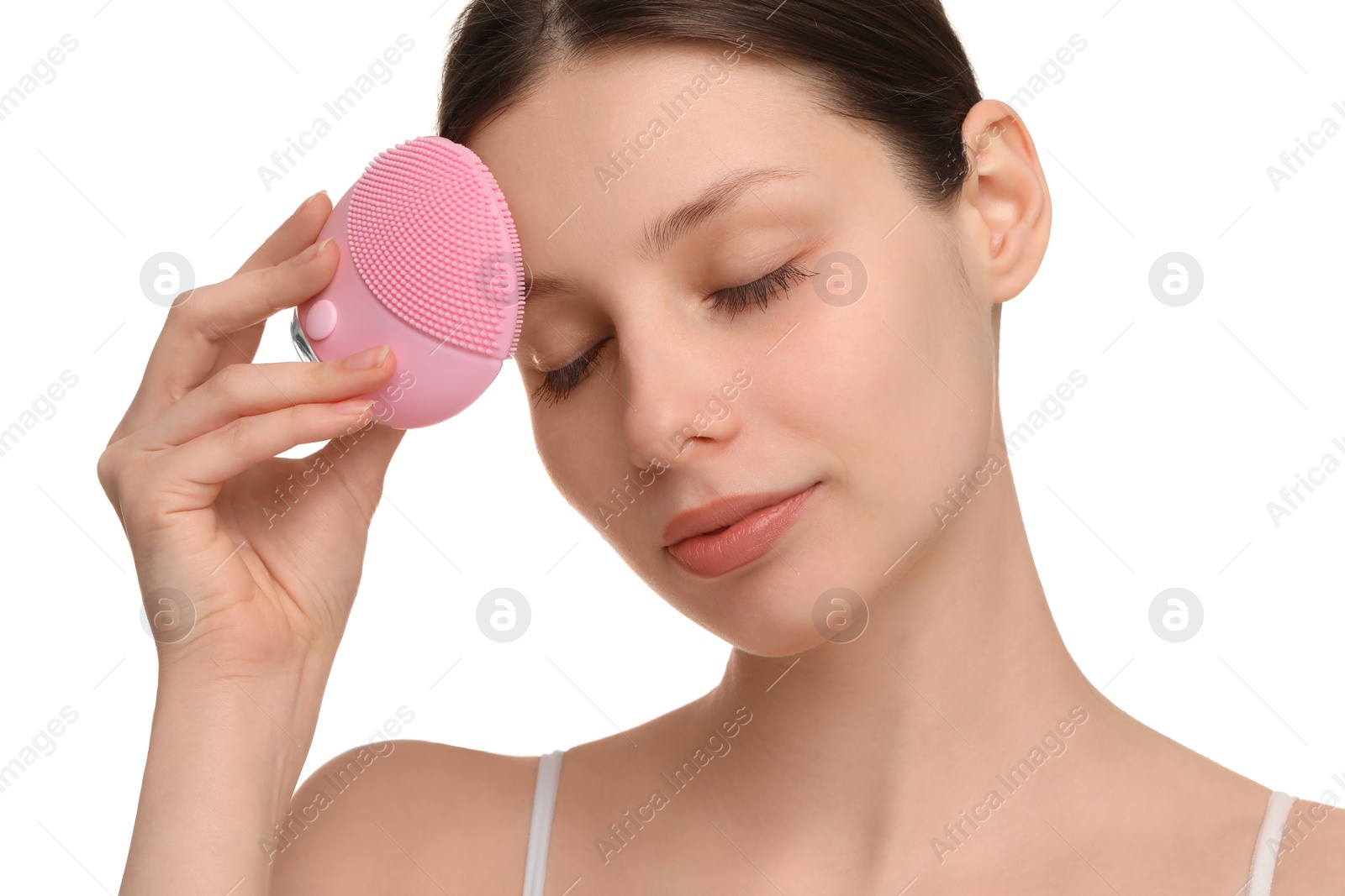 Photo of Washing face. Young woman with cleansing brush on white background