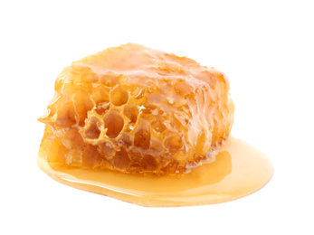 Photo of Piece of tasty fresh honeycomb isolated on white