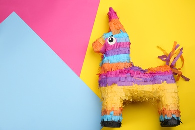 llama shaped pinata on color background, top view. Space for text