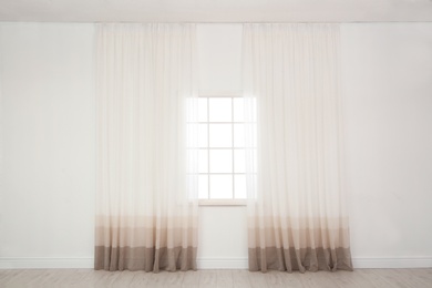 Modern window with curtains in room. Home interior