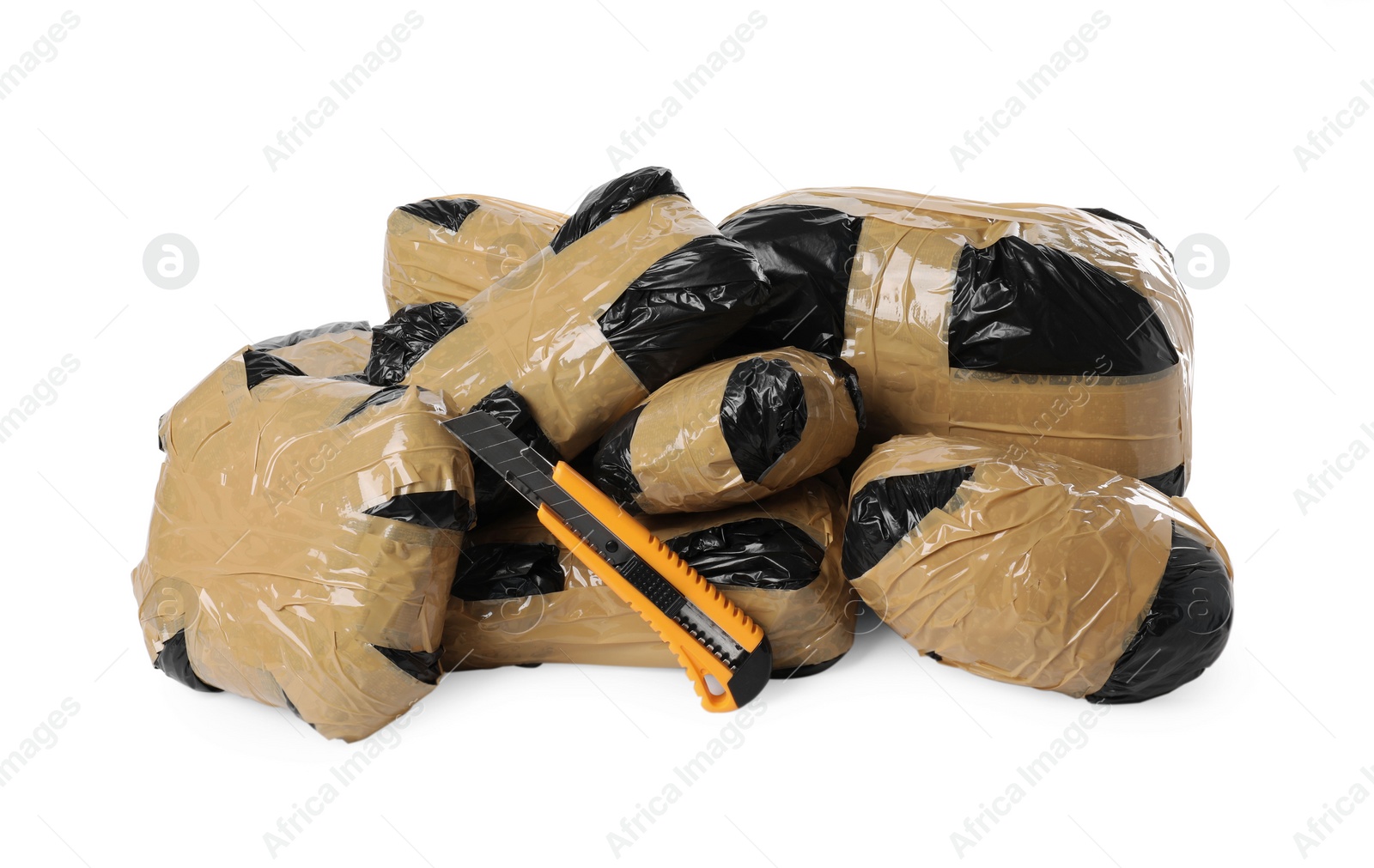 Photo of Packages with narcotics and stationery knife isolated on white