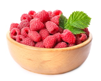 Bowl of delicious fresh ripe raspberries with leaves on white background