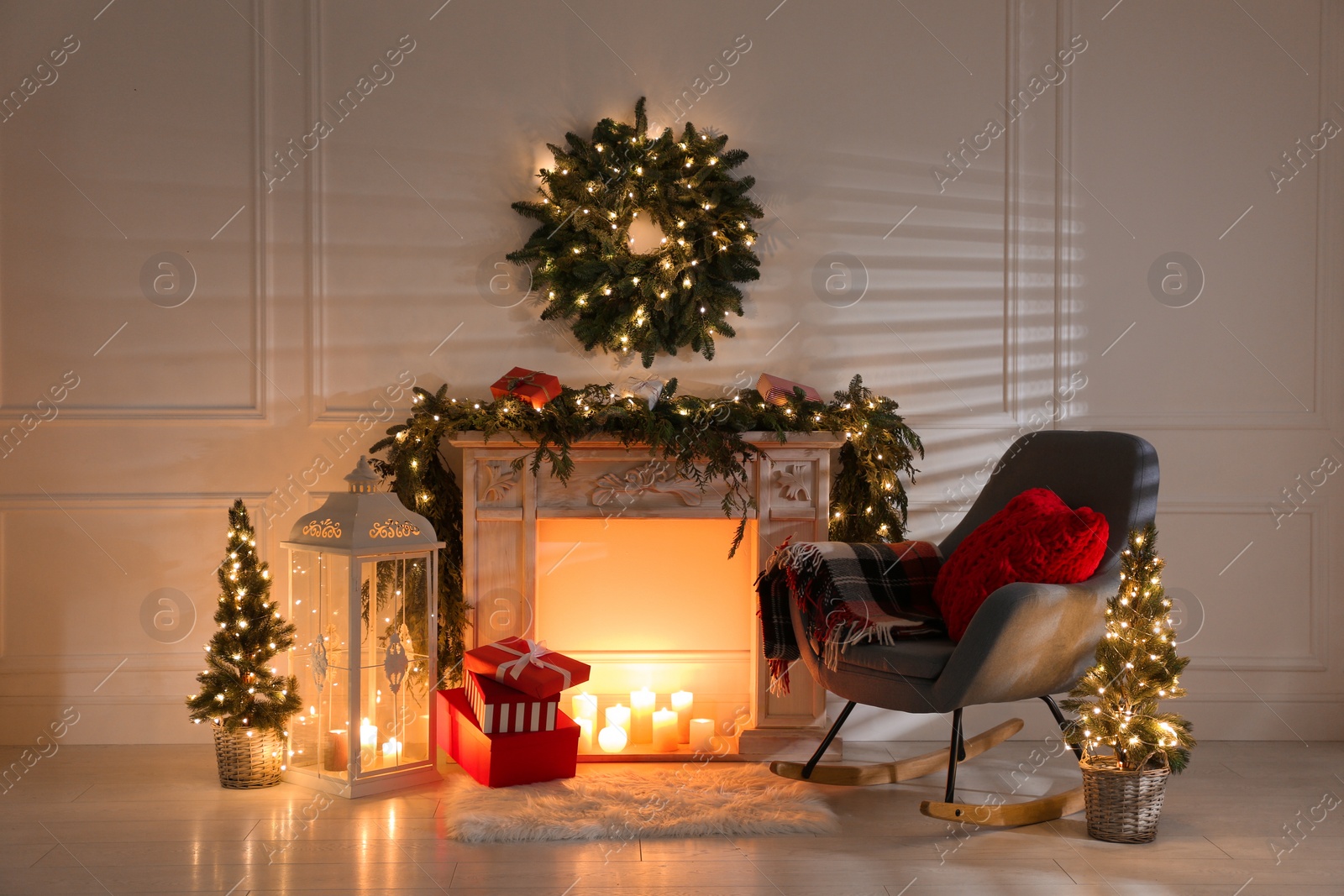 Photo of Beautiful Christmas themed photo zone with fireplace and fir decor