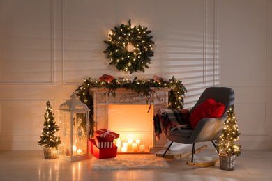 Beautiful Christmas themed photo zone with fireplace and fir decor