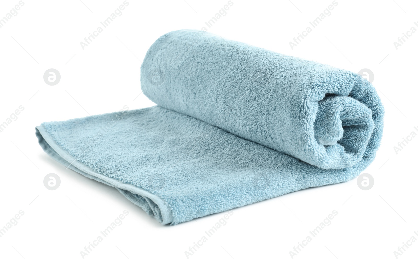 Photo of Rolled soft terry towel on white background