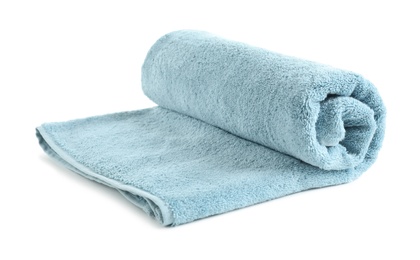 Rolled soft terry towel on white background