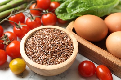 Photo of Many different healthy food on light marble table, closeup