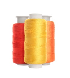 Photo of Different colorful sewing threads on white background