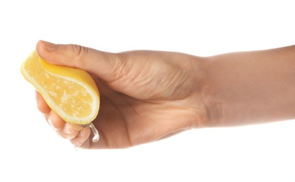 Photo of Young woman squeezing lemon on white background