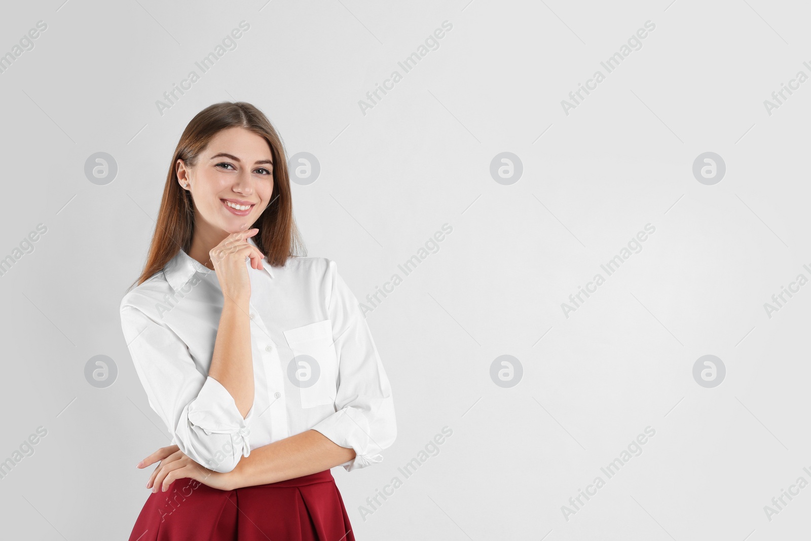 Photo of Portrait of beautiful young businesswoman on white background. Space for text