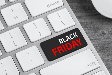 Image of Computer keyboard with Black Friday button, closeup. Online shopping 