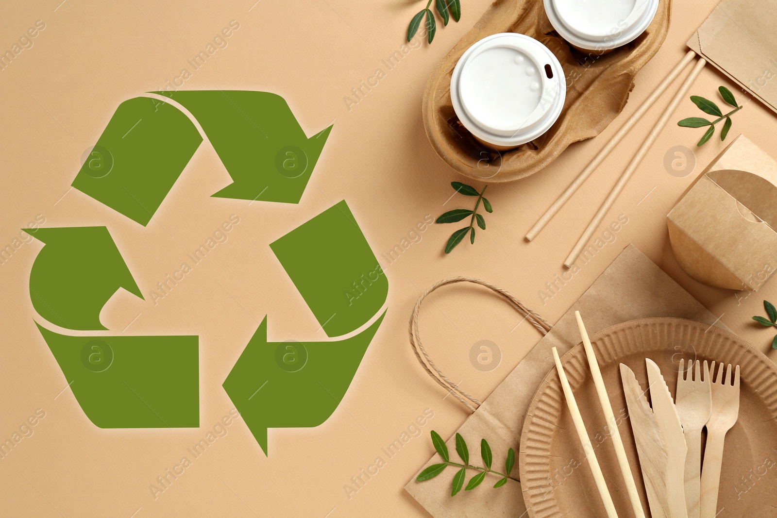 Image of Flat lay composition of eco friendly products and recycling symbol on beige background