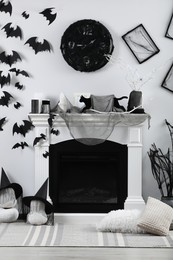 Stylish room with fireplace decorated for Halloween