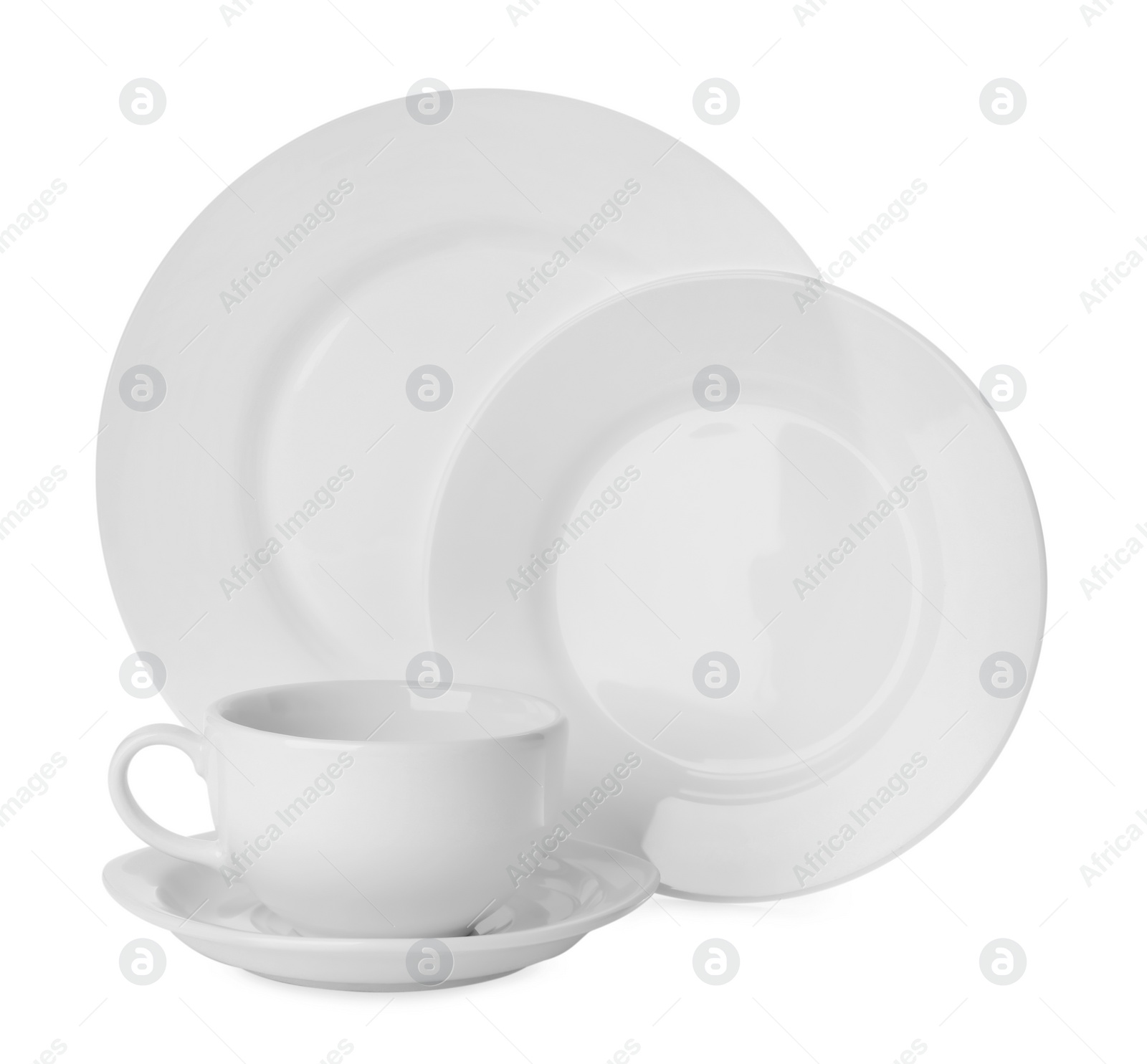 Photo of Set of clean tableware on white background