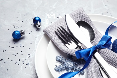 Photo of Beautiful Christmas table setting on grey background, closeup