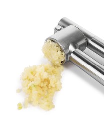 Photo of One metal press and crushed garlic isolated on white