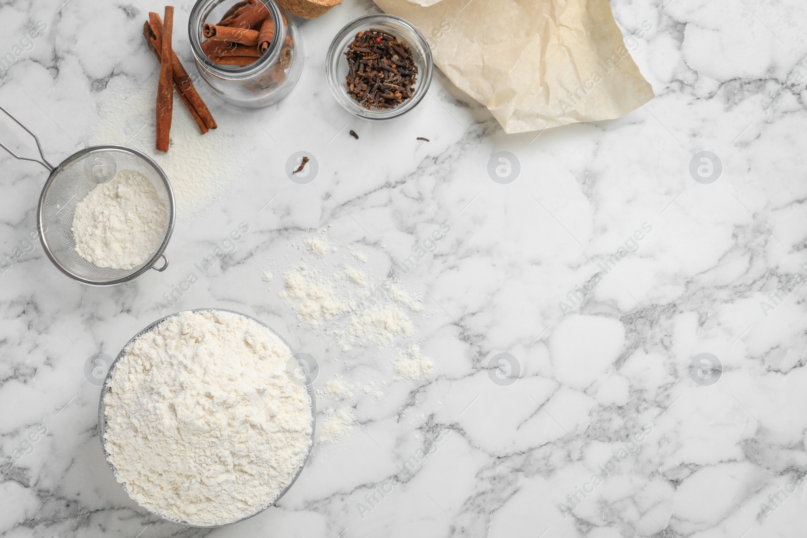 Photo of Composition with flour and spices on light background, top view