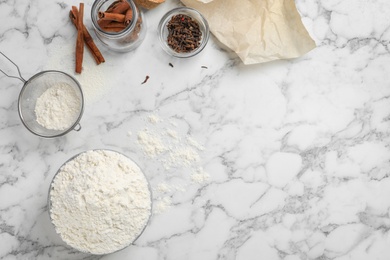 Photo of Composition with flour and spices on light background, top view