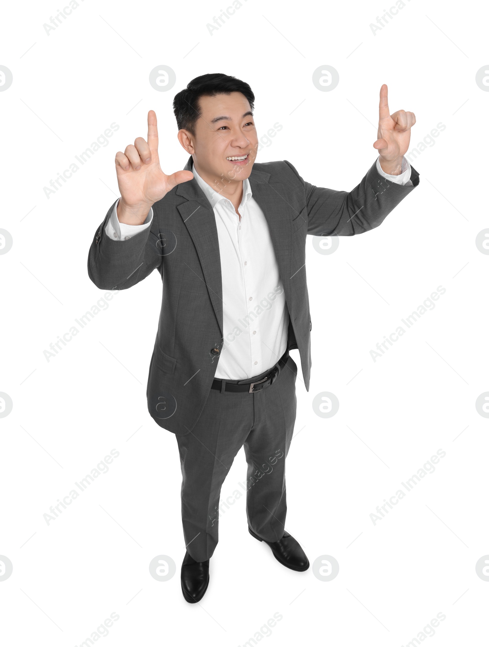 Photo of Businessman in suit posing on white background, above view