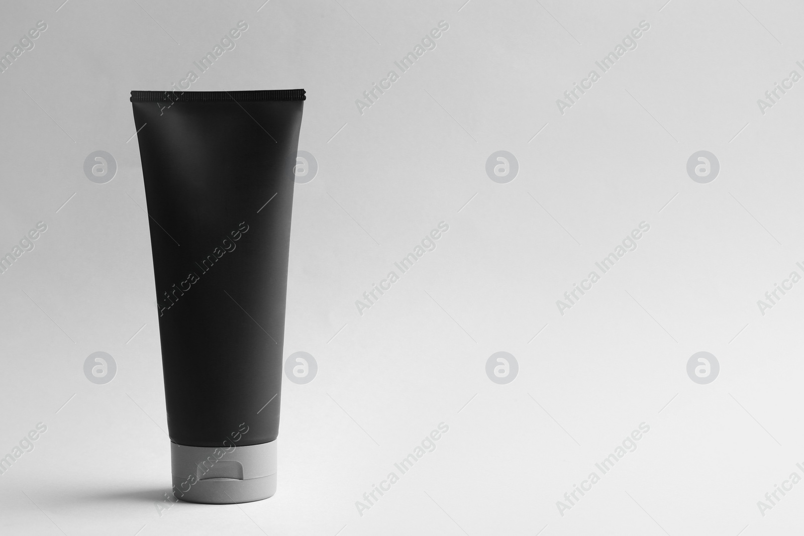 Photo of Men's cosmetic product on light background. Space for design