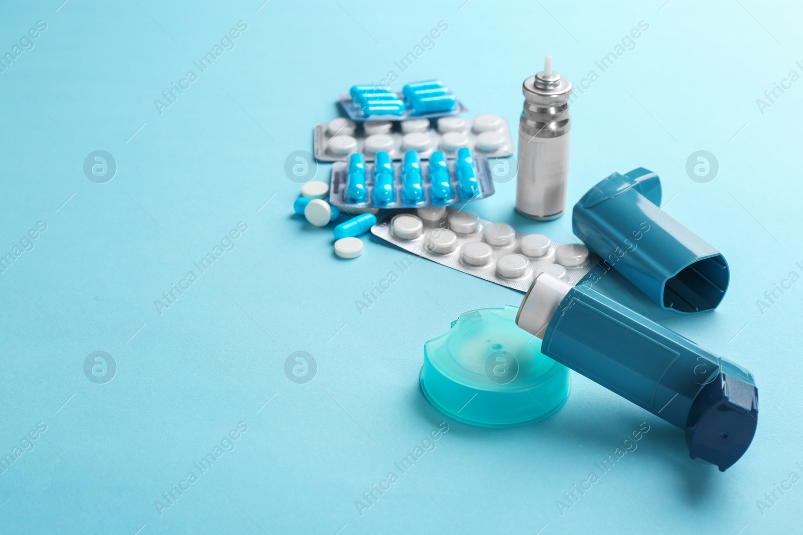 Photo of Asthma medications and space for text on color background