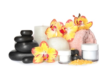 Photo of Composition with spa stones and candles on white background