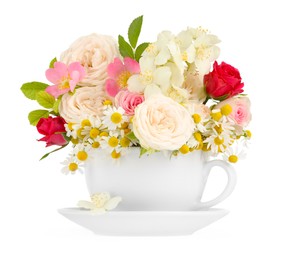 Photo of Aromatic herbal tea in cup with different flowers isolated on white