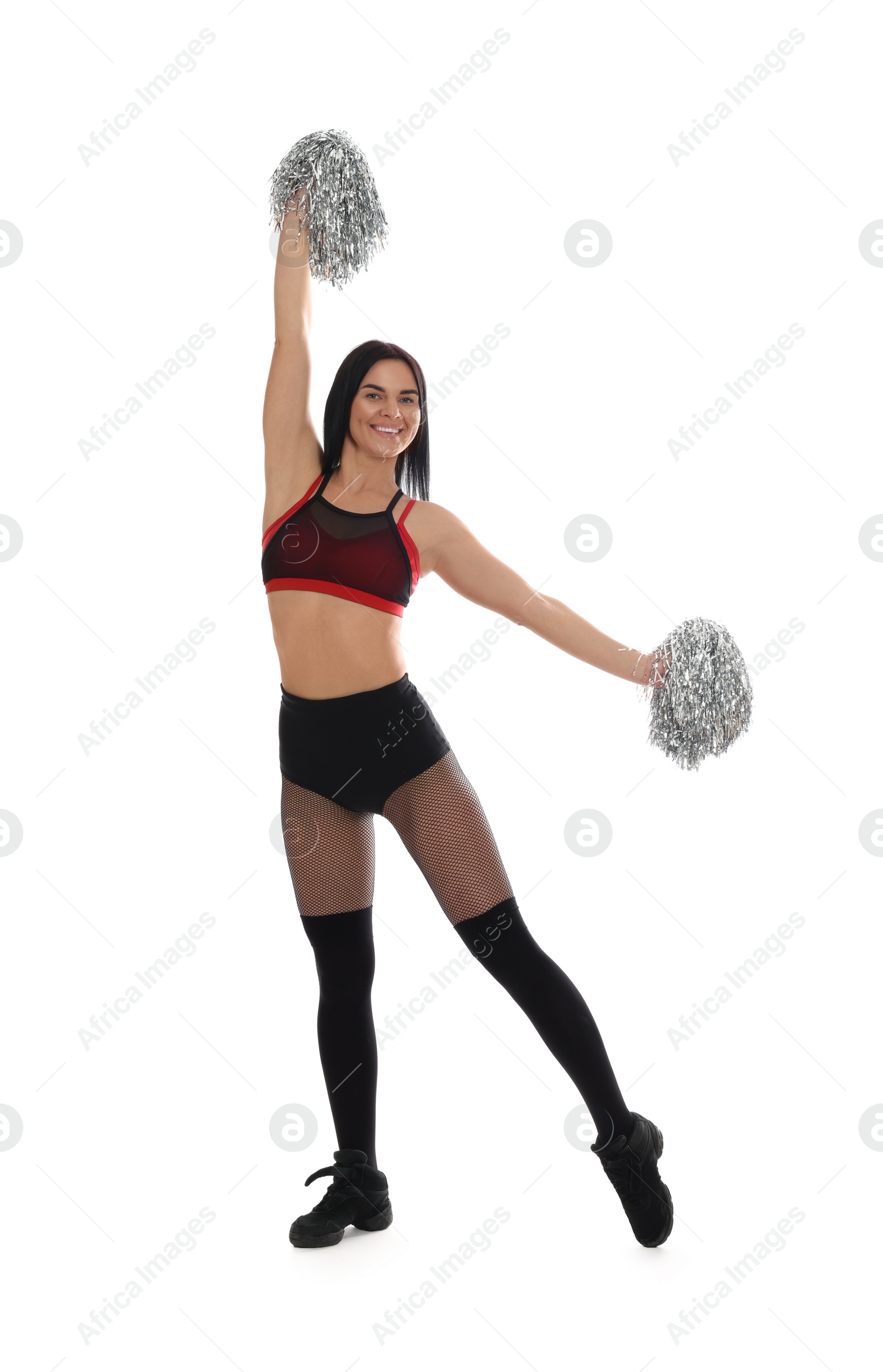 Photo of Beautiful cheerleader in costume holding pom poms on white background