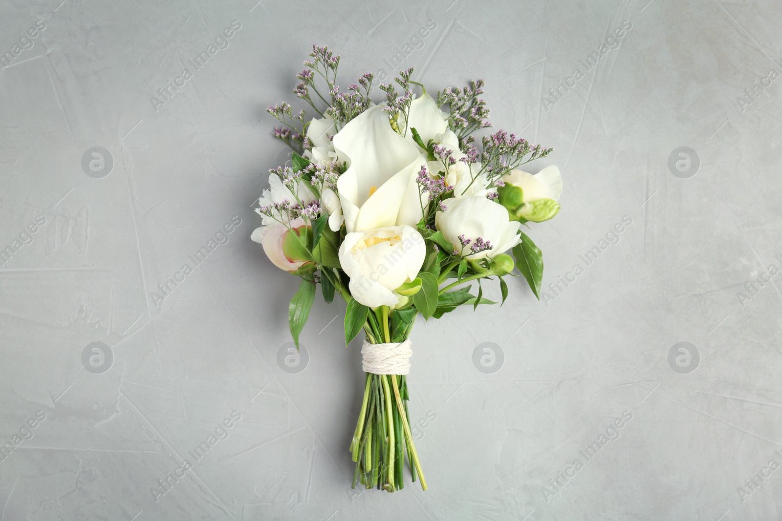 Photo of Bouquet of beautiful fragrant flowers on table