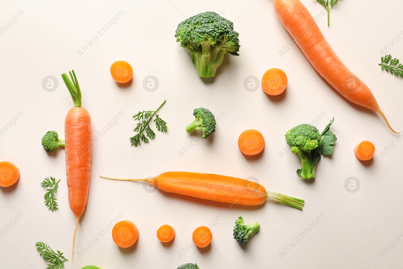 Photo of Flat lay composition with fresh vegetables on color background