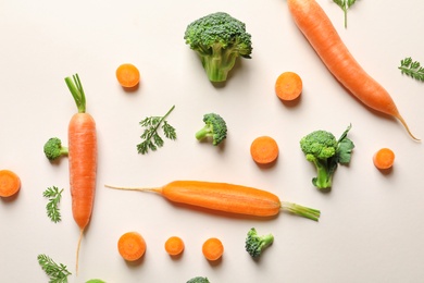 Photo of Flat lay composition with fresh vegetables on color background