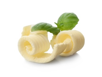 Tasty butter curls on white background