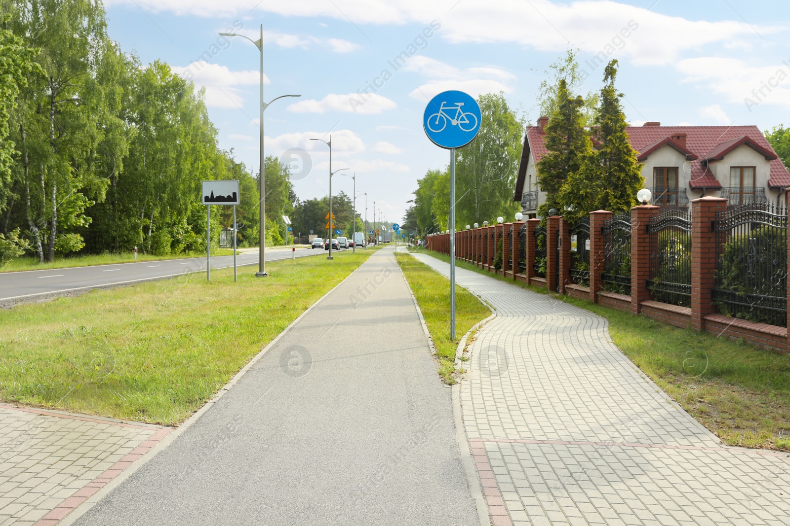 Photo of Bicycle and pedestrian lanes outdoors on sunny day